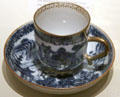 Porcelain cup & saucer painted with Chinese theme in blue at National Museum of Scotland. Edinburgh, Scotland.