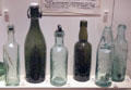 Commercial Scottish glass bottles at National Museum of Scotland. Edinburgh, Scotland.