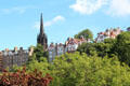 The Hub above heritage residential buildings of Old Town seen from Princes Street Gardens. Edinburgh, Scotland.