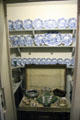 Pantry safe with porcelain dinnerware & silver dishes at Georgian House museum. Edinburgh, Scotland.