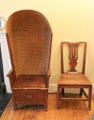 Porter's chair with enclosed woven rope back to shield drafts plus simple side chair in housekeeper's room at Georgian House museum. Edinburgh, Scotland.