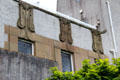 Sandstone carvings as conceived by C.R. Mackintosh on facade of House for an Art Lover. Glasgow, Scotland.