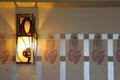C.R. Mackintosh designed rose wall panels flank light fixture in drawing room at Hill House. Helensburgh, Scotland.