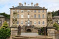 Carved lions guarding gates of garden entrance to Pollok House. Glasgow, Scotland.
