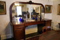 Sideboard with mirror in dining room of Reid farmhouse at National Museum of Rural Life. Kittochside, Scotland