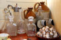 Decanters & jars in poop cabin pantry of Glenlee Tall Ship. Glasgow, Scotland.