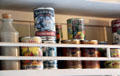 Antique canned goods in poop cabin pantry of Glenlee Tall Ship. Glasgow, Scotland.