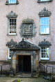 Arms of Nova Scotia supported by Native American & mermaid carved above entrance of Argylls Lodging. Stirling, Scotland.