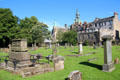 Graveyard at Dunfermline Abbey with city hall tower beyond. Dunfermline, Scotland.