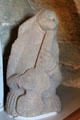Gargoyle stone carving of musician playing guitar-like-instrument at Dunfermline Palace. Dunfermline, Scotland.