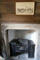 Fireplace & iron firebox in garden room at Culross Palace. Culross, Scotland.