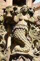 Mermaid beside carved bulls head on Linlithgow Palace fountain. Linlithgow, Scotland.