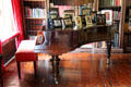 Grand piano & family photos in Large Library at Hopetoun House. Queensferry, Scotland.