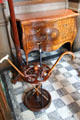 Cane rack & bow front bureau with marquetry in entrance hall at Lauriston Castle. Edinburgh, Scotland.