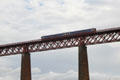 Scotrail train on Firth of Forth rail bridge. Queensferry, Scotland.