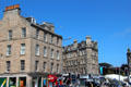 Town square of Edinburgh district of Leith with 1880s stone buildings. Edinburgh, Scotland.
