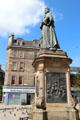 Queen Victoria statue marks her visit to harbor of Leith in town square on New Kirkgate St. Edinburgh, Scotland