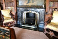 Library fireplace flanked by carved Italian armchairs at Abbotsford House. Melrose, Scotland.