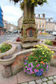 Queen Victoria plaque & flowers at base of Jedburgh Jubilee Fountain. Jedburgh, Scotland.