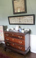 Samplers over chest of drawers in north dressing room at Manderston House. Duns, Scotland.