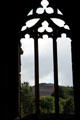 Surrounding hills seen through window of Melrose Abbey. Melrose, Scotland.