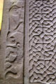 Pictish Droston stone front detail of lace of cross beside carved birds at St Vigeans Museum. Arbroath, Scotland.