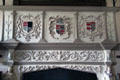 Family crests over fireplace mantle in Billiard room at Glamis Castle. Angus, Scotland.