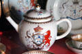 Porcelain teapot with Lyon coat of arms crest with unicorn & lion in Malcolm's room at Glamis Castle. Angus, Scotland.