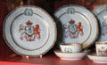 Porcelain plates with Lyon coat of arms crest with unicorn & lion in Malcolm's room at Glamis Castle. Angus, Scotland.