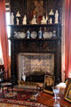 Fireplace with porcelain figures & plates in Queen Mother sitting area at Glamis Castle. Angus, Scotland.