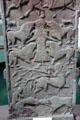 Pictish cross-slab detail with strips showing Vanora execution scene , centaur, & beast biting ox head with man with club behind at Meigle Sculptured Stone Museum. Meigle, Scotland.