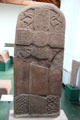 Pictish cross-slab with lacey surface & entwined animals in corners at Meigle Sculptured Stone Museum. Meigle, Scotland.