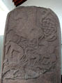 Pictish cross-slab with horseman over animals & swirled crescent at Meigle Sculptured Stone Museum. Meigle, Scotland.