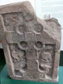 Pictish cross-slab with complete circles in cross corners, lacework & animals with turned heads at Meigle Sculptured Stone Museum. Meigle, Scotland.