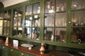 Pantry shelves with ceramics & silver at Hill of Tarvit Mansion. Cupar, Scotland.