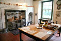 Kitchen with cast-iron range & copper vessels at Hill of Tarvit Mansion. Cupar, Scotland.
