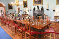Dining room with collection of ivory statuettes & paintings along wall at Scone Palace. Perth, Scotland.