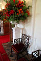 Floral display & Chinese-style chair in long gallery at Scone Palace. Perth, Scotland.