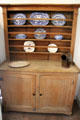 Kitchen cupboard with China at Robert Burns House. Dumfries, Scotland.