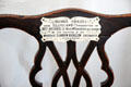Burns' chair with presentation plaque at Robert Burns House. Dumfries, Scotland.