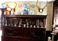 Entrance parlor sideboard with pewter & porcelain collection at Broughton House. Kirkcudbright, Scotland.