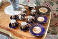 Individually painted cups, saucers & cake plates in morning room at Fyvie Castle. Turriff, Scotland.