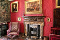 Library fireplace with Trial of Charles I painting above at Fyvie Castle. Turriff, Scotland.