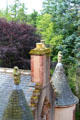 Carved bears holding shields atop turrets of Fyvie Castle. Turriff, Scotland.