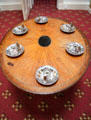 Round table with silver candle holders complete with snuffers in Square room at Haddo House. Methlick, Scotland.