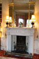 Morning room fireplace with mantle mirror & lamps at Haddo House. Methlick, Scotland.