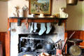 Farmhouse kitchen hearth with cookware at Pitmedden Garden. Pitmedden, Scotland.