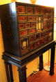 Inlaid collection cabinet on stand at Brodie Castle. Brodie, Scotland.