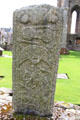 Pictish stone carved with horseback riders in hunting scene, double disk & crescent decorated with spirals, all symbols in Pictish art, at Elgin Cathedral. Elgin, Scotland.