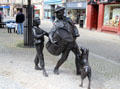 Sculpted bronze highland drummer with boy & dog on Elgin High Street. Elgin, Scotland